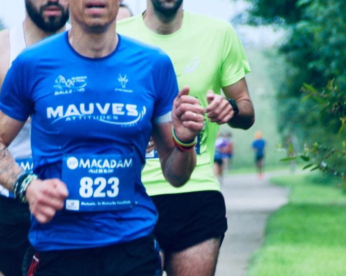 a group of men running down a road
